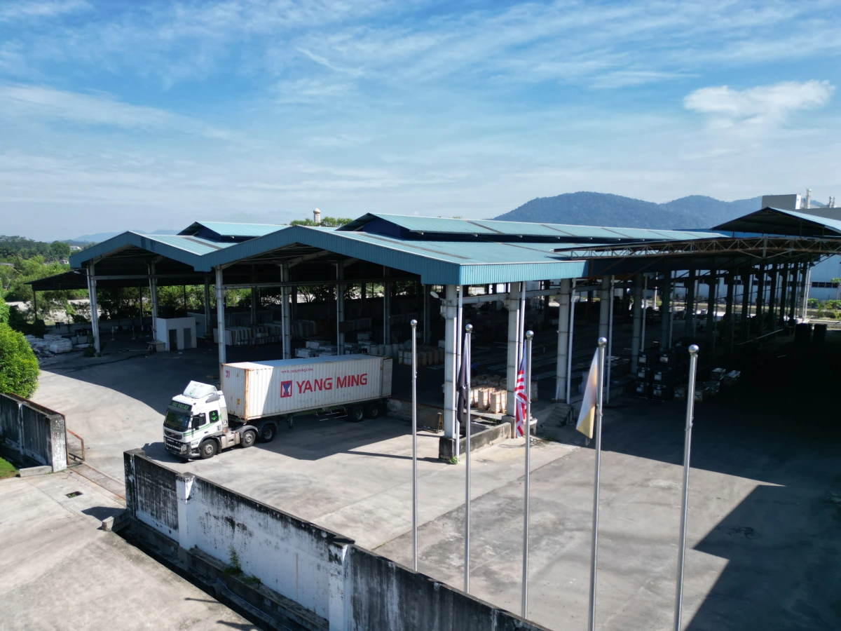 LIVO Quartz Malaysia factory exterior with container loading area for quartz slab export supply
