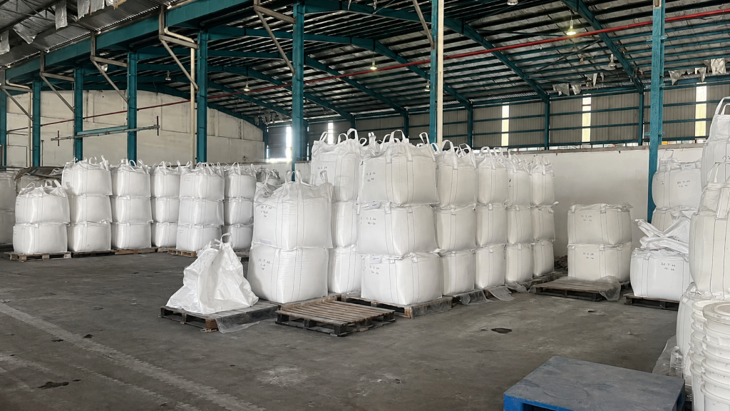 Raw material storage area with bulk bags inside a Malaysia quartz factory
