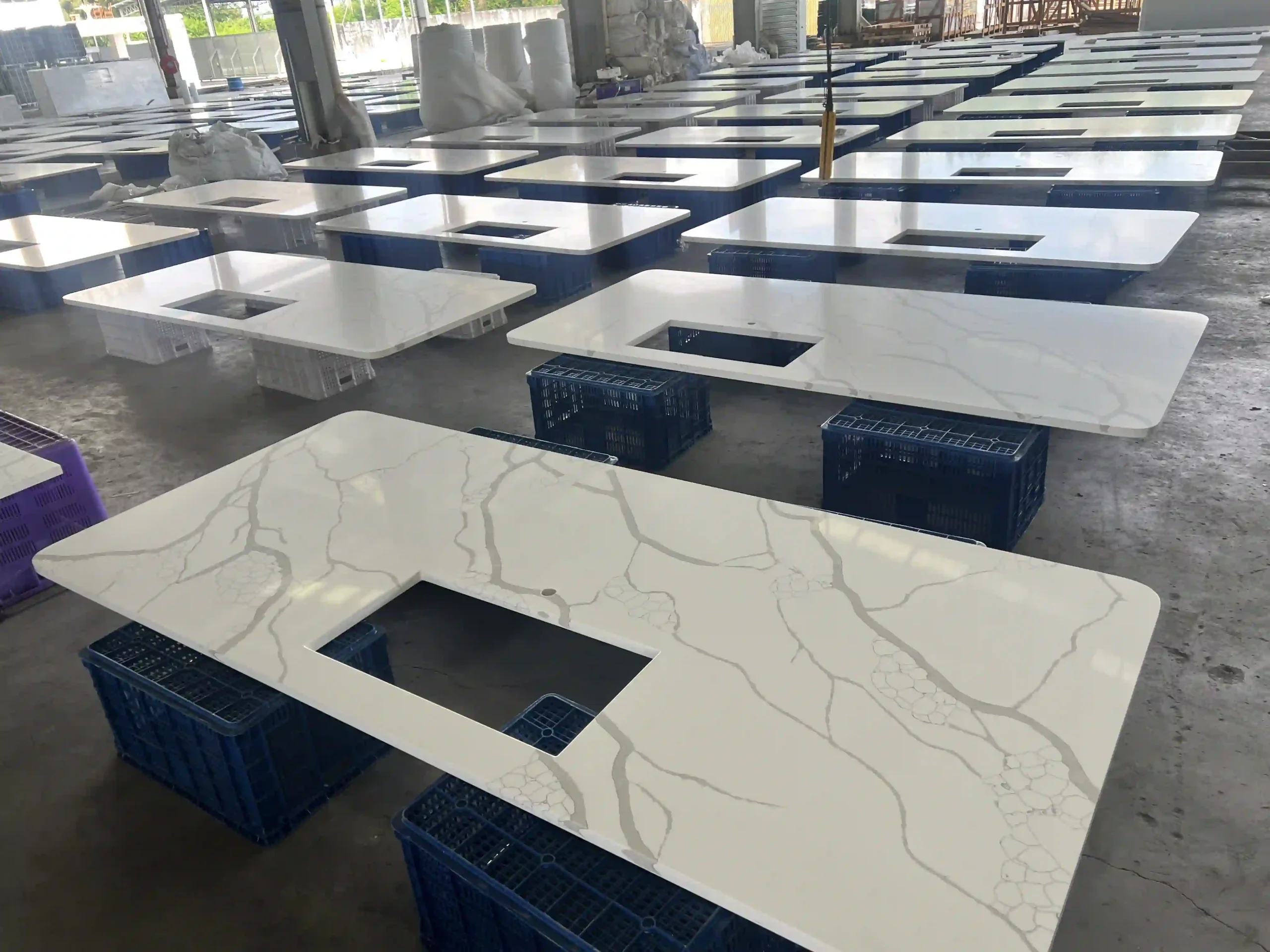 Calacatta style quartz vanity tops with rectangular sink cutouts