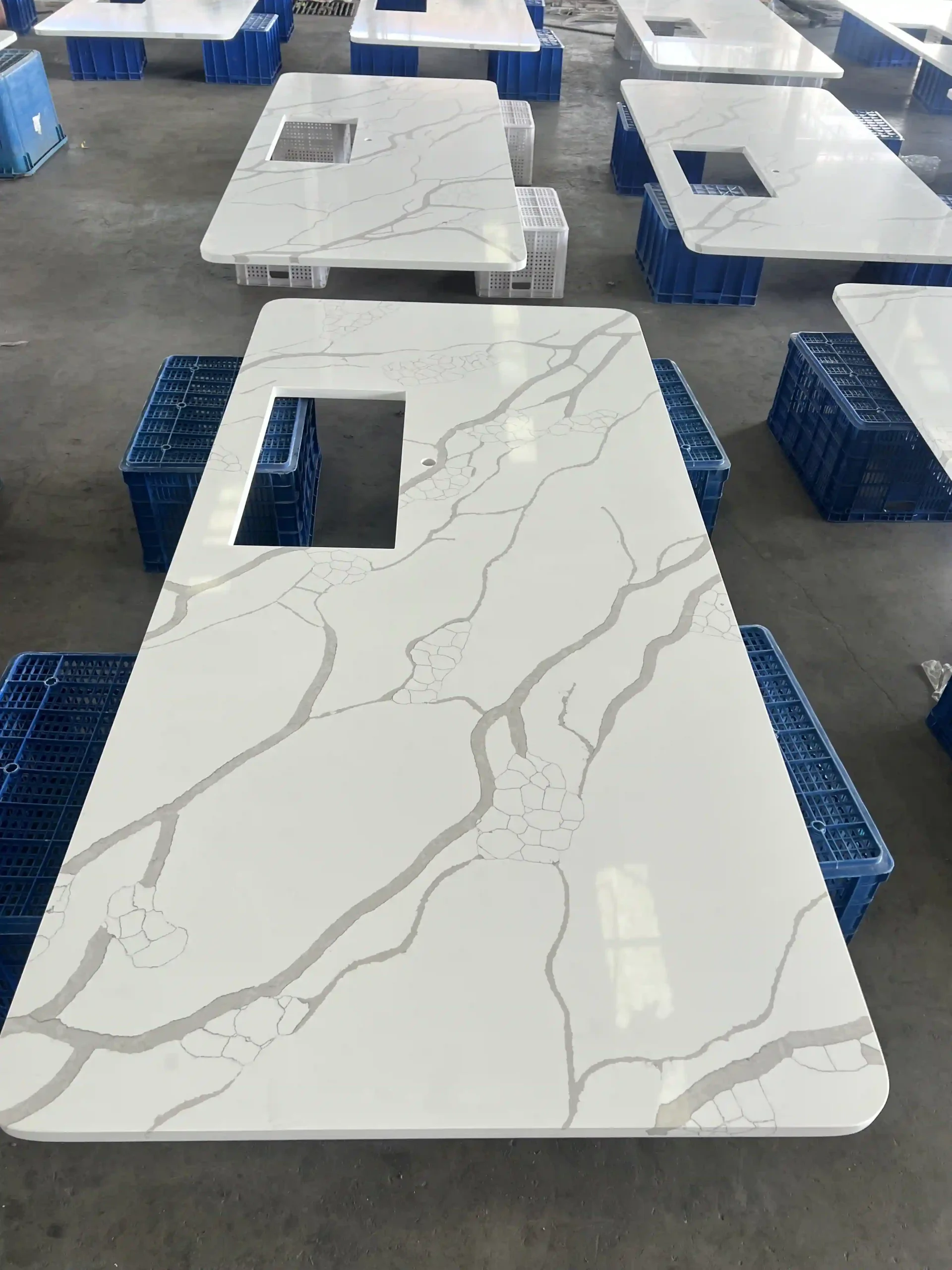 Single white quartz vanity top with a rectangular basin cutout